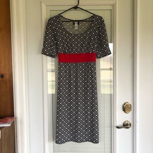 Black with white circles short sleeved dress with red tie